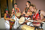 four drummers pounding out some tribal percussion