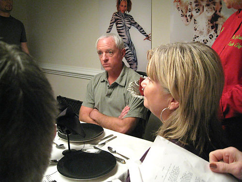 Bodypaintings on the wall of the dining room scene