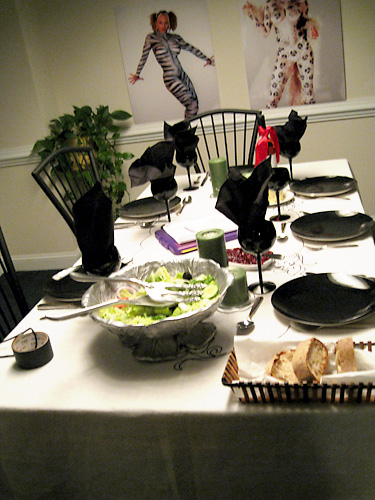 Bodypaintings on the wall of the dining room scene