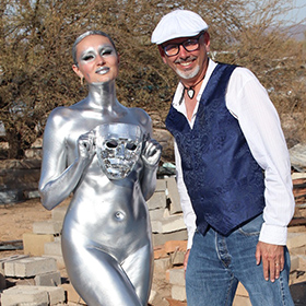 Carrie Esser in silver bodypaint at the Junkyard