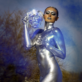 Carrie Esser in silver bodypaint at the Junkyard