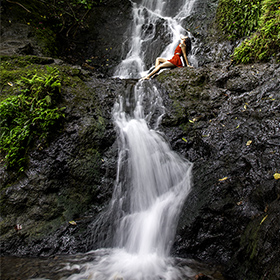 Likelike Falls in Oahu, Hawaii with model Savannah Greenawalt.
